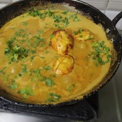 A picture of Appam with Egg kurma.