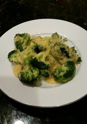 A picture of Brad's steamed broccoli with roasted hatch chile cheese sauce.