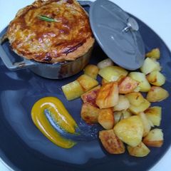 A picture of Chicken and Mushroom Pot Pie with Sautéed Potatoes.