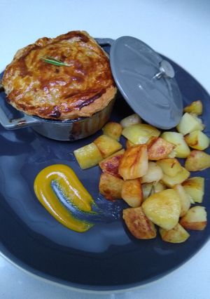 A picture of Chicken and Mushroom Pot Pie with Sautéed Potatoes.