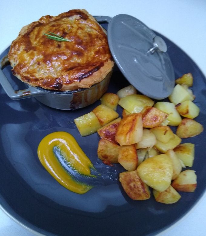 A picture of Chicken and Mushroom Pot Pie with Sautéed Potatoes.