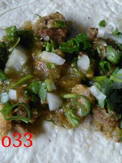 Una foto de Taco de Chamorro en salsa verde