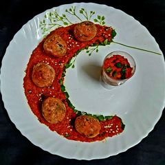 A picture of Red Pepper Chutney with paneer balls.