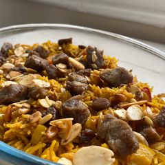 A picture of Kabsa spices + Kabsa rice - Saudi rice with lamb meat.