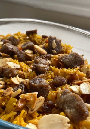 A picture of Kabsa spices + Kabsa rice - Saudi rice with lamb meat.