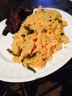 A picture of Tomato rice with beans.