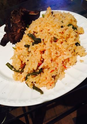 A picture of Tomato rice with beans.