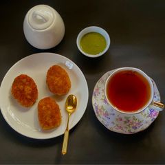 A picture of Paneer Cutlet with Darjeeling tea.