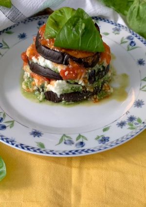 A picture of Summer Eggplant Parmigiana with Basil Pesto, Buffalo Mozzarella, and Roasted Tomatoes.
