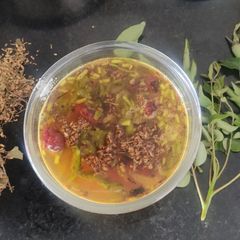 A picture of Neem flower rasam.