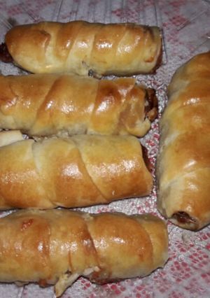 Una foto de Panchos envueltos con panceta y muzzarella