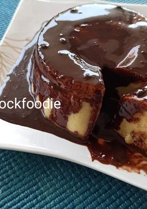 A picture of Custard Cake with chocolate Syrup.