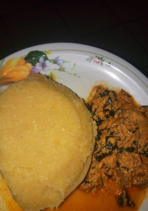A picture of Egusi soup with eba.