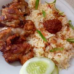 A picture of Nasi Tomat rice cooker + Ayam Goreng Bawang Putih.