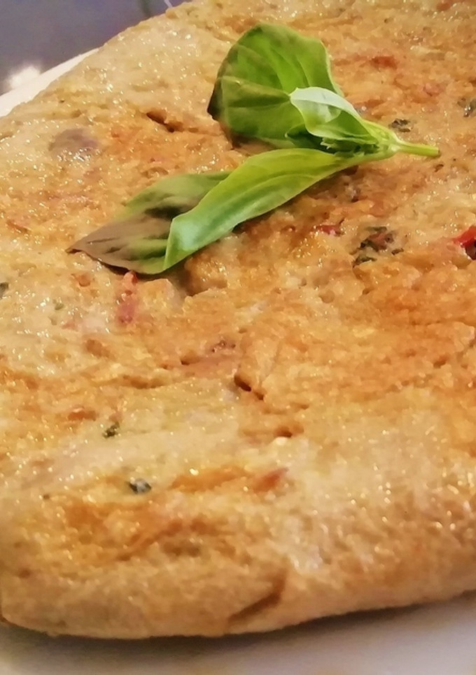 Una foto de Tortilla de Alcachofas, champiñones y Langostinos