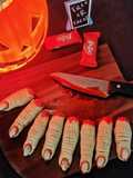 Witch finger cookies with strawberry coulis blood