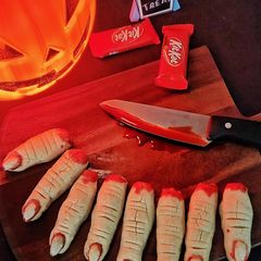 A picture of Witch finger cookies with strawberry coulis blood.