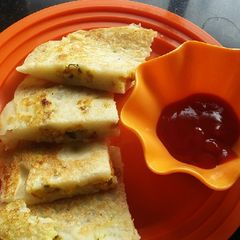 A picture of Suji uttapam Anda(bhurji) sandwich.