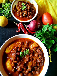 A picture of Desi-Style Chana Aloo (Desi-Style Chickpea and Potato Curry).