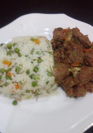 A picture of Vegetable rice with dry beef.