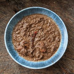 A picture of Khasi Smokey Black Sesame Chicken Curry.