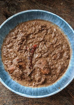 A picture of Khasi Smokey Black Sesame Chicken Curry.