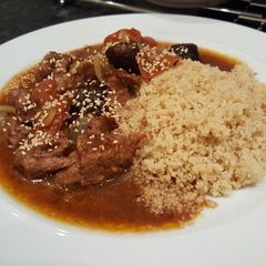A picture of Lamb tagine with prunes and almonds.