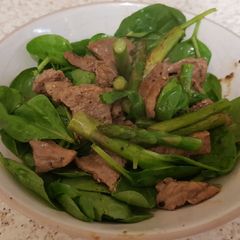 A picture of Beef Strips & Asparagus cooked in Garlic Butter.