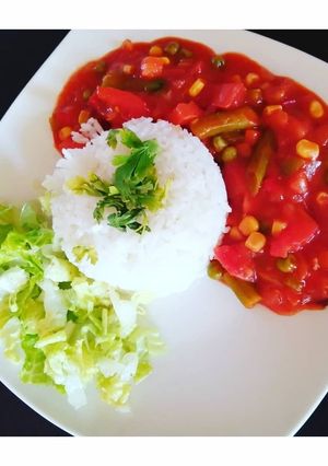 Una foto de Tomatican con arroz