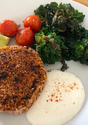 A picture of Spiced Sweet potato, Black Bean and Chick-pea burgers with Lime Raita.