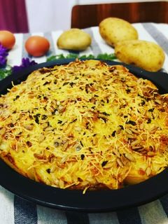 Una foto de Irresistible huevos con patatas gratinados al horno