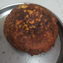 A picture of Gujarati handvo kadhai ma.
