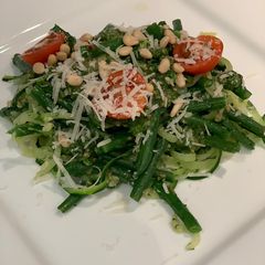 A picture of Courgetti with pesto and green beans.
