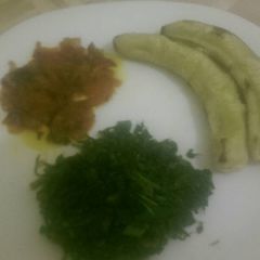 A picture of Matoke served with steamed spinach and tomato paste.