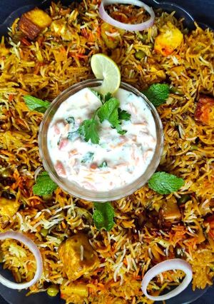 A picture of Paneer Biryani in pressure cooker.