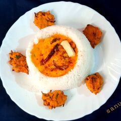 A picture of Buttery Kadhi In Rice Bowl.