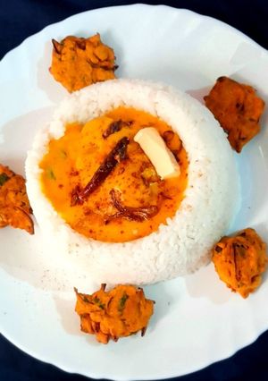 A picture of Buttery Kadhi In Rice Bowl.