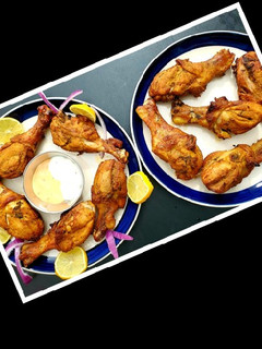 A picture of Tandoori chicken in Oven Gas stove.
