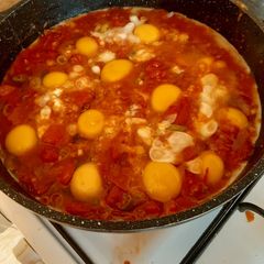 A picture of Shakshuka or (Tomato Eggs).