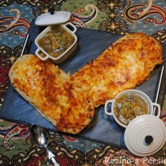 A picture of Garlic bread with cheese.