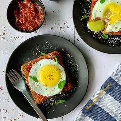 A picture of Marinara sunny side up egg toast.