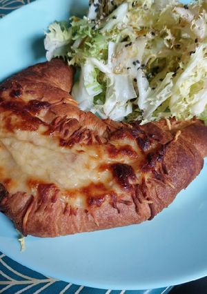 A picture of Ham Croissant with Mornay Sauce.