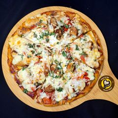 A picture of Cheese Burst Veggies And Chicken Pizza From Scratch.