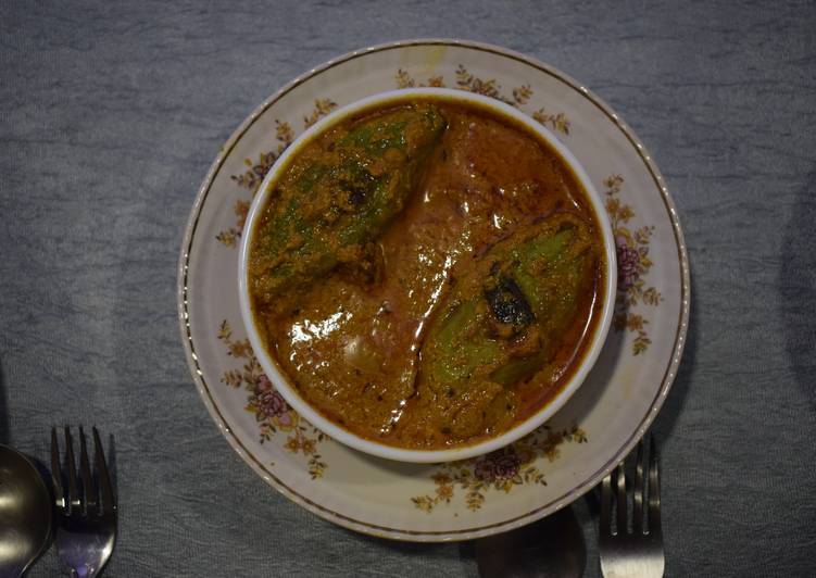 Recipe of Speedy Potoler dorma (stuffed pointed gourd curry)