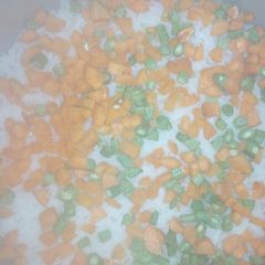 A picture of White rice with carrot and green beans.