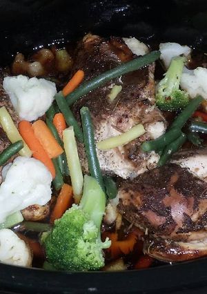 A picture of Jerk Chicken Breast in the Crockpot with Vegetables .