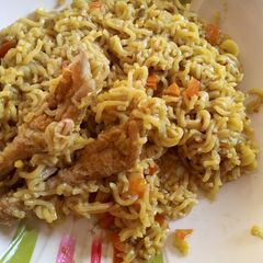 A picture of Tasty Indomie and chicken legs.