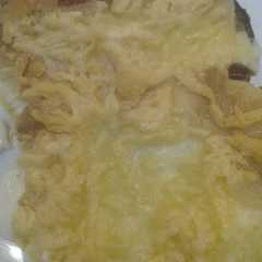 Una foto de Patatas con gratinado de ali-oli y queso