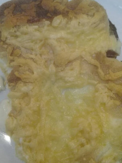 Una foto de Patatas con gratinado de ali-oli y queso