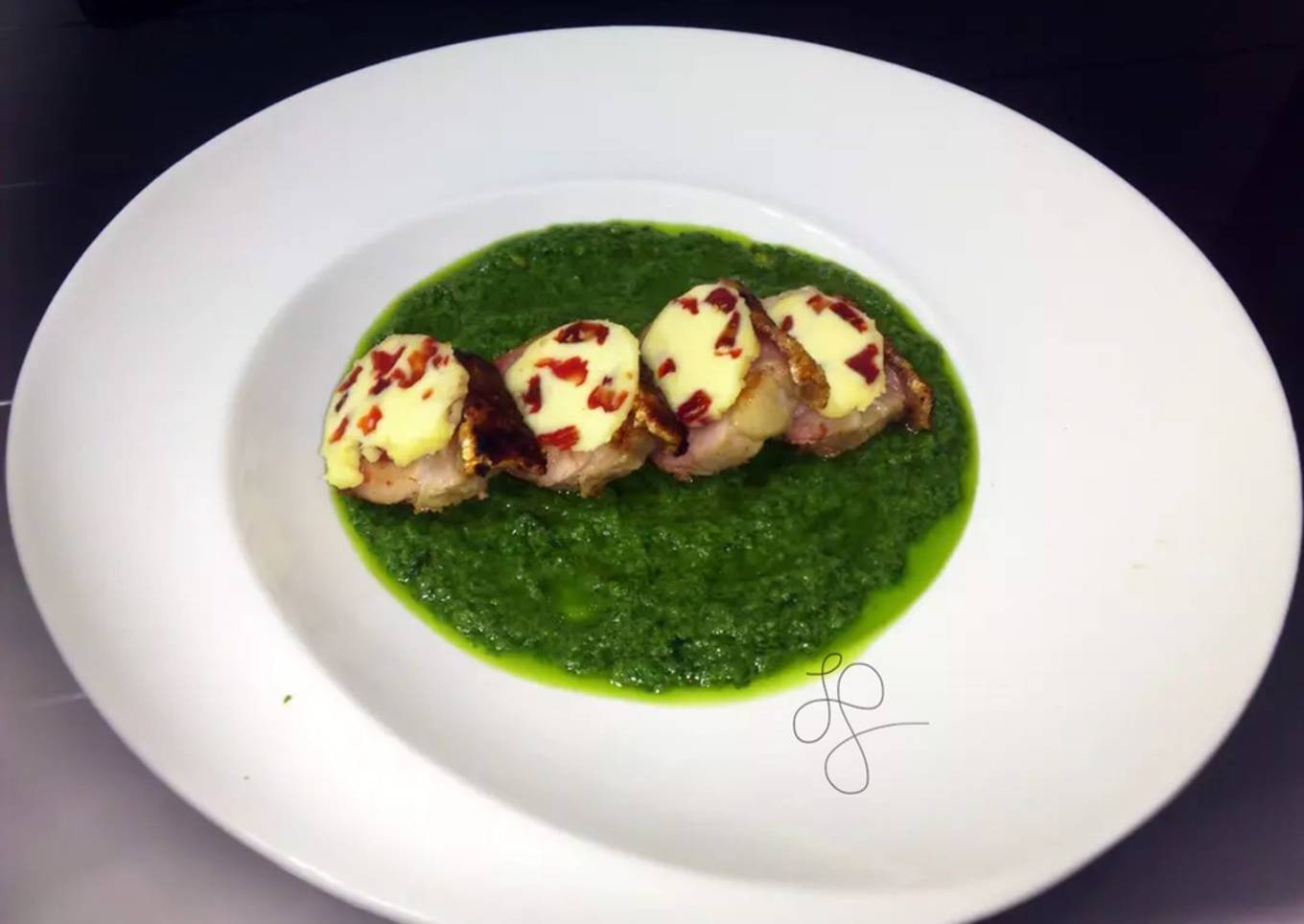 Roasted Pork Top Sun Dried Tomato Butter On Pesto Sauce
